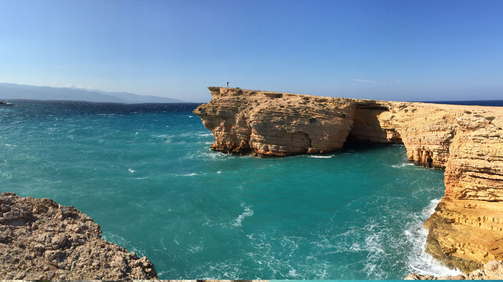 view of the cliffs of the island of koufounissi greece