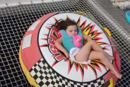 Little girl relaxing on catamaran