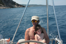 Father and Daughter at the helm of Pluto catamaran